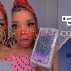 Lady shocked as she receives an iPhone 14 Pro Max from a man on Instagram (video) - NaijaPepper